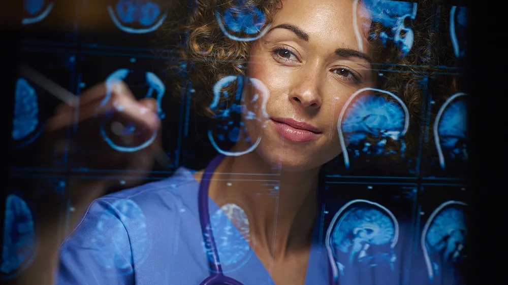 ALT Text: a medical practitioner looking at X-rays  